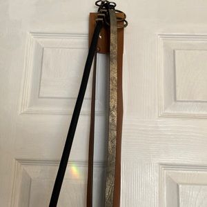 a pack of four belts in good condition. size 5. Brown, Black, and gold.